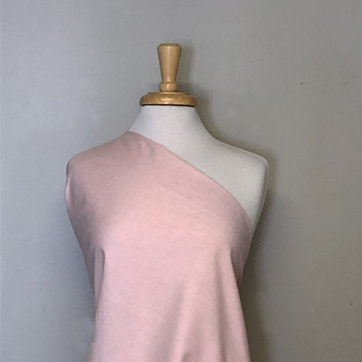 Sunwashed Chambray fabric by the yard draped on a mannequin 